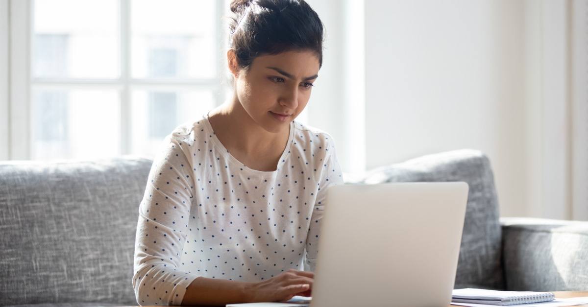 Woman looking at her laptop